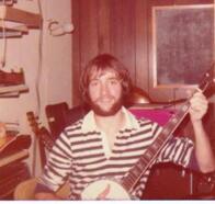 Jerry playing banjo in Mr. Griffith's shop, 1975/